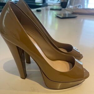 Miu miu patent leather heals.